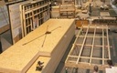 préfabrication de caissons de toiture et murs ossature bois en atelier avec pose de l'isolation et des menuiseries extérieures